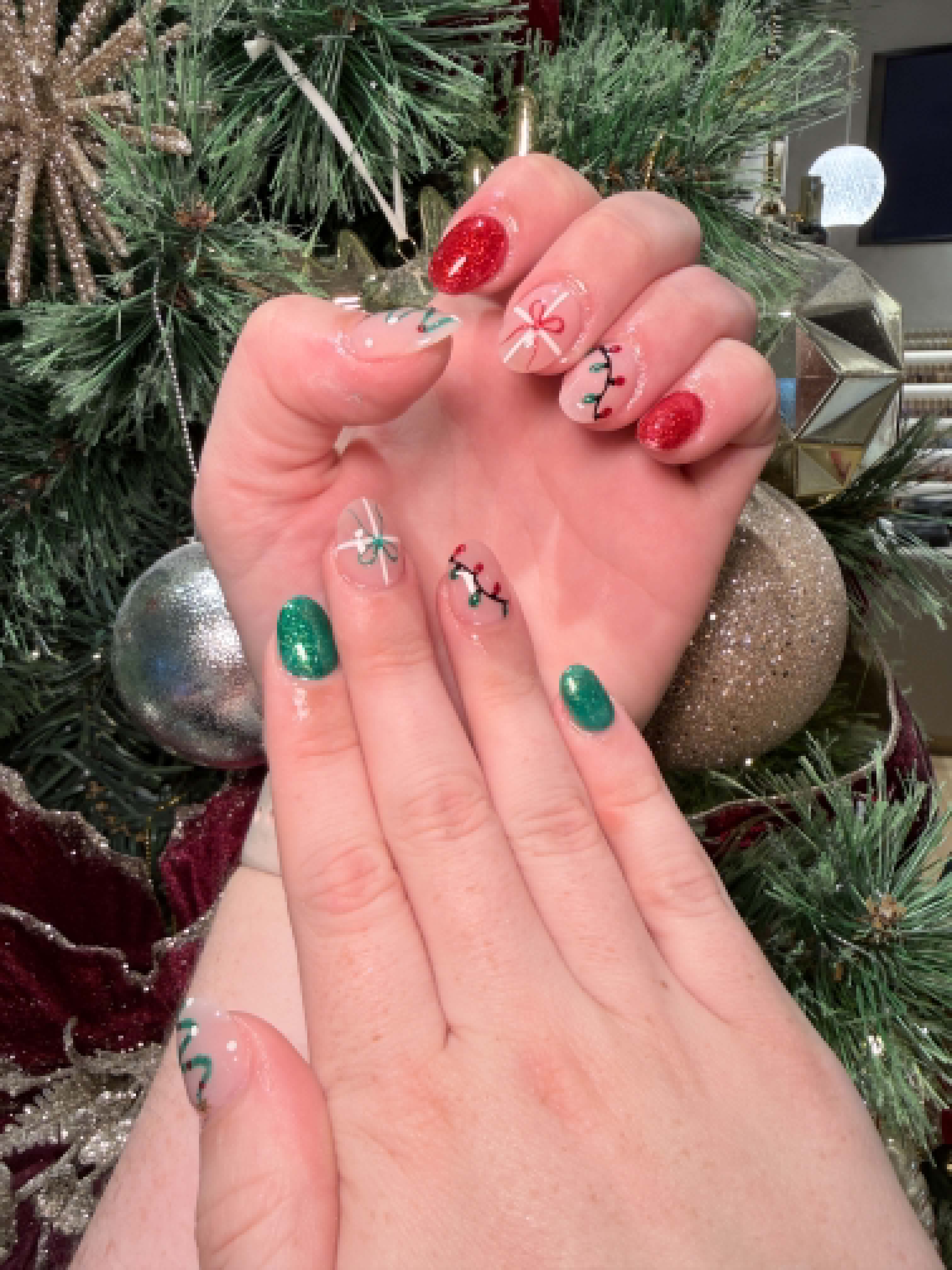 Christmas nails with green glitter and festive bow art — Caitlyn Nails