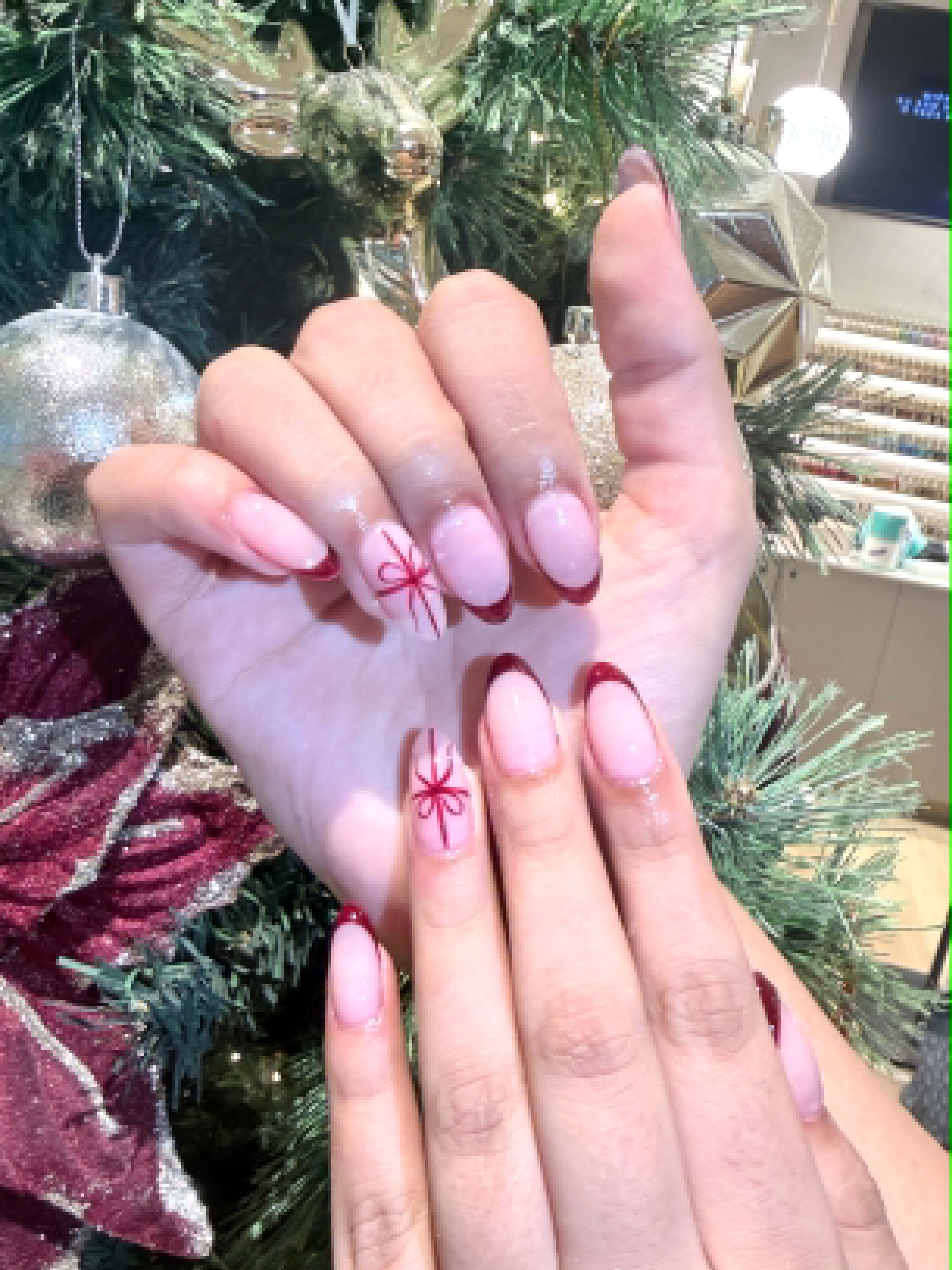 Christmas pink nails with red ribbon bow art — Caitlyn Nails