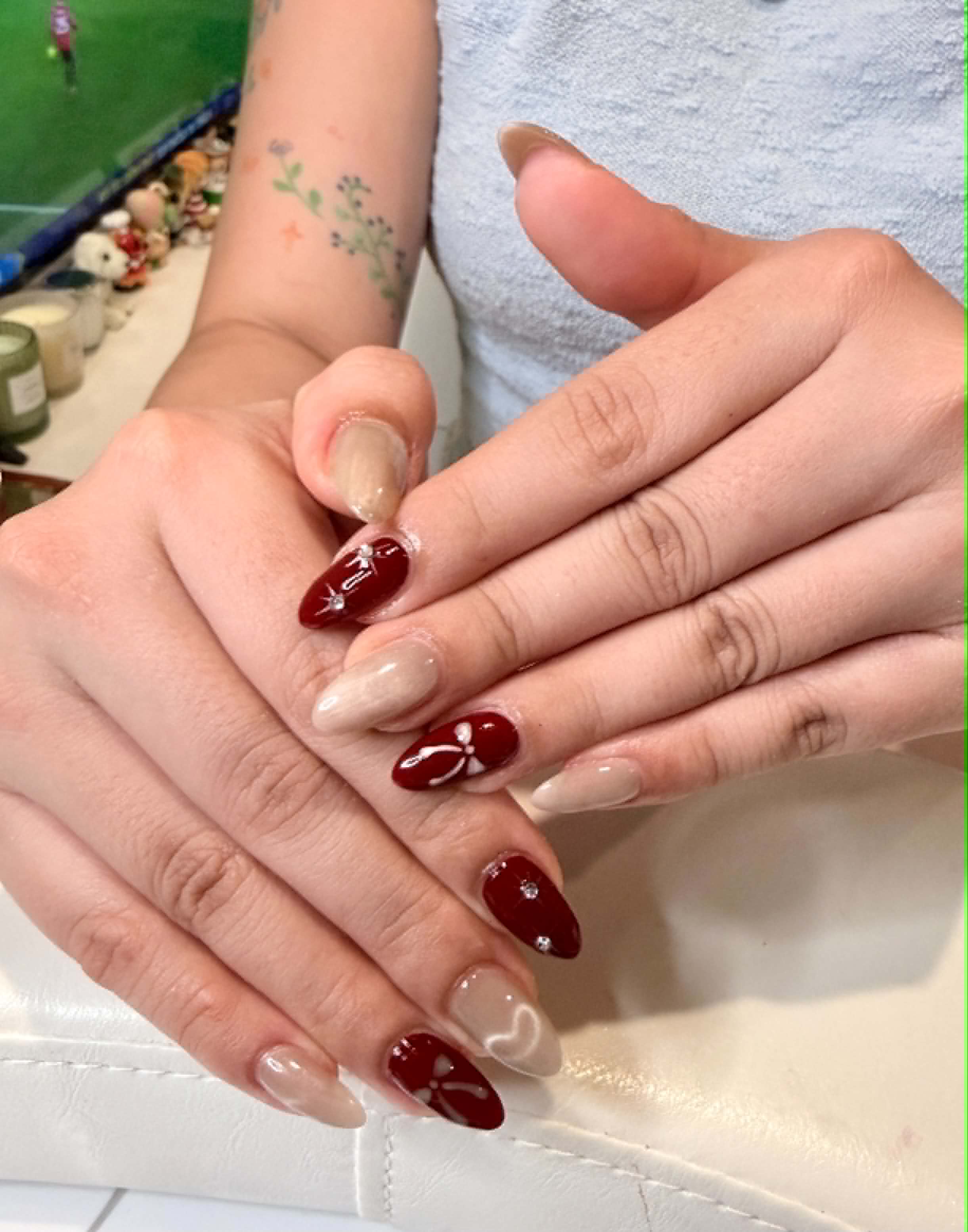 Dark red nails with white bow nail art — Caitlyn Nails