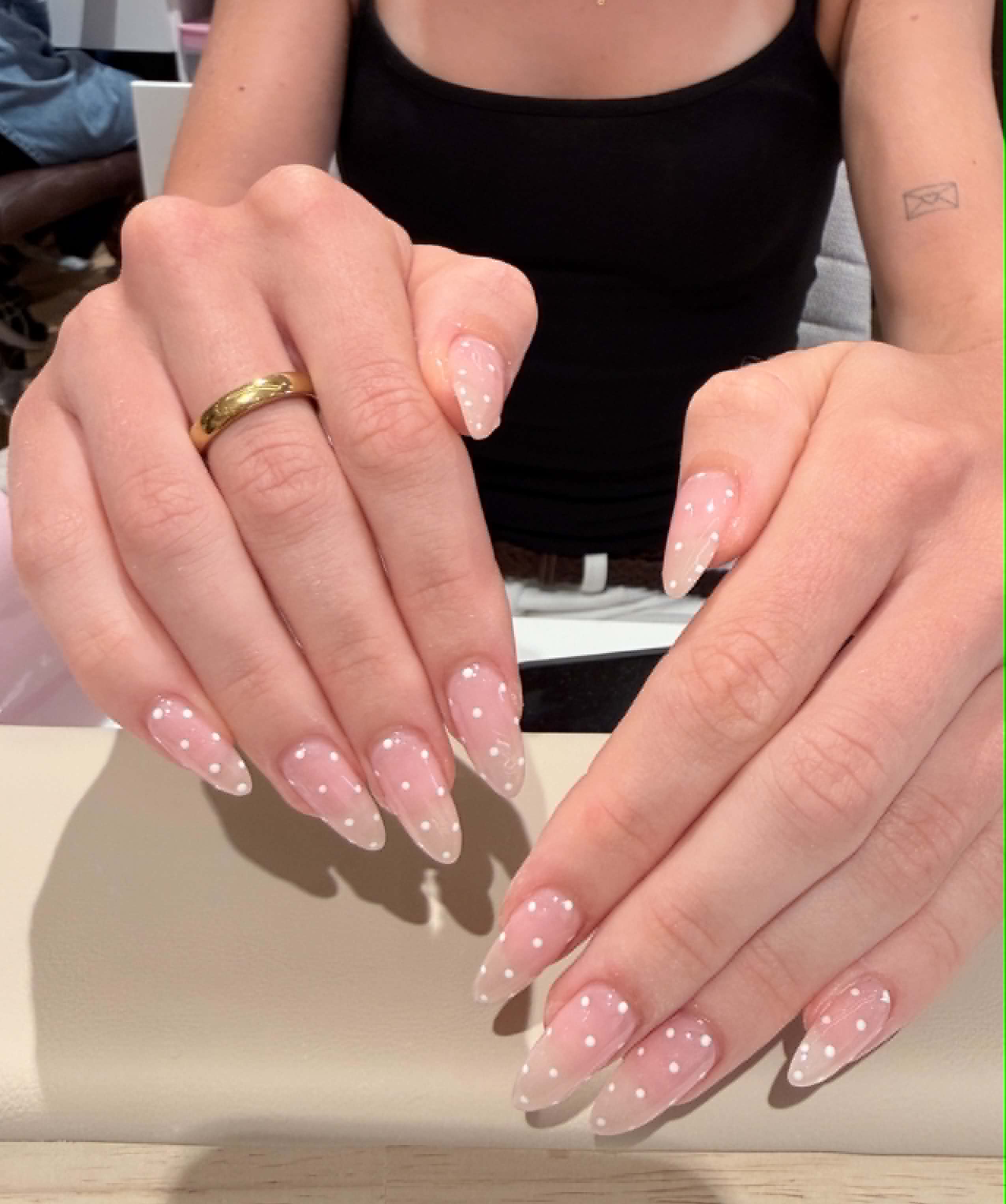 Sheer pink almond nails with white polka dots — Caitlyn Nails